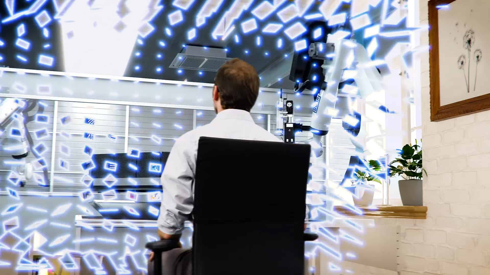Darsteller sitz auf einem Bürostuhl und wird in die virtuelle Werkstatt des DXQ Digital Intelligence by Dürr eingesaugt.